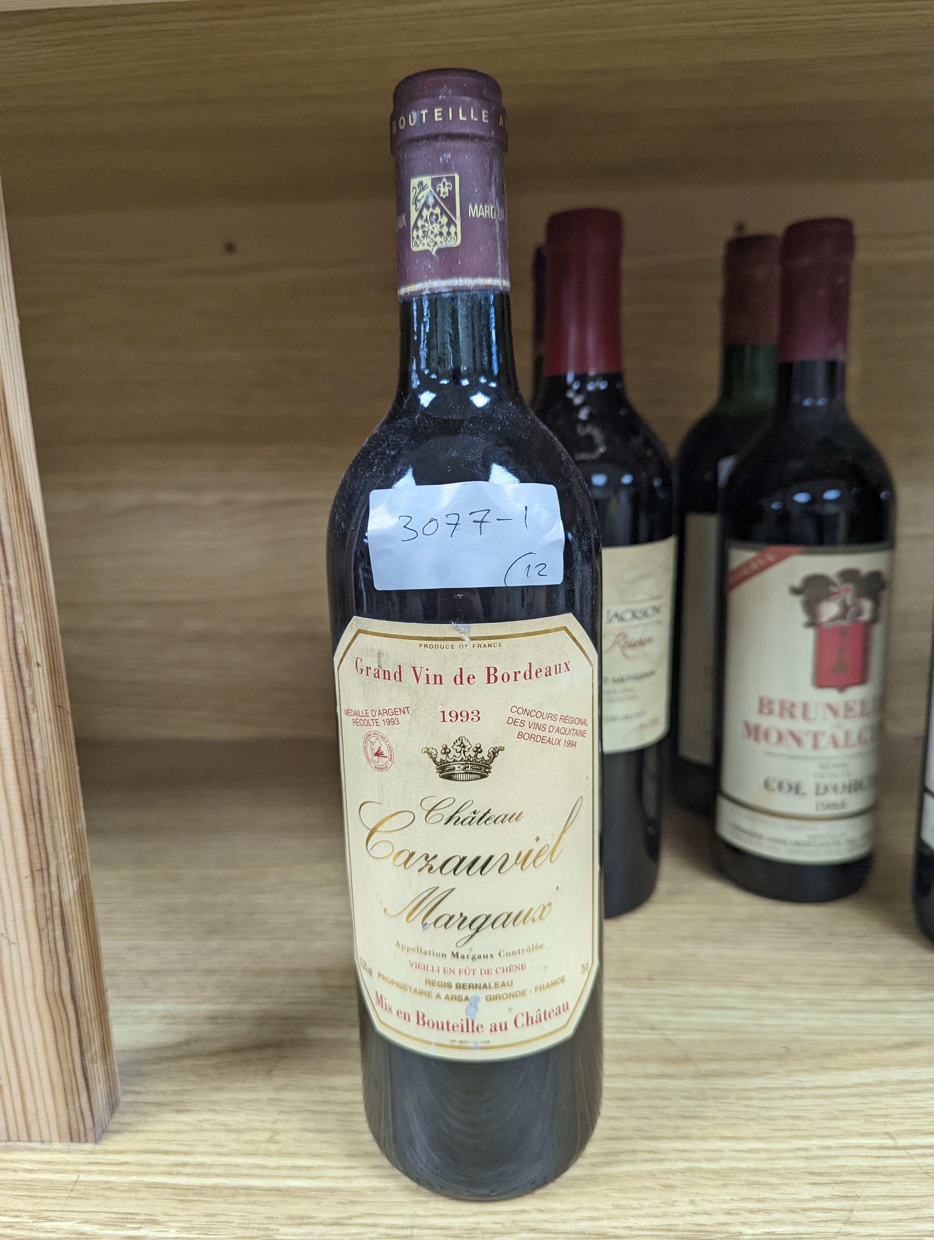Twelve assorted bottles of wine including one Opus One, 1988, one Vosne Romanee, Jean Paul Selles, 1992, one Chateau Cazauviel, Margaux 1993, Chateau Pontet-Canet, 1986 and Brunello Montalcino, 1985 & 1991 etc.
